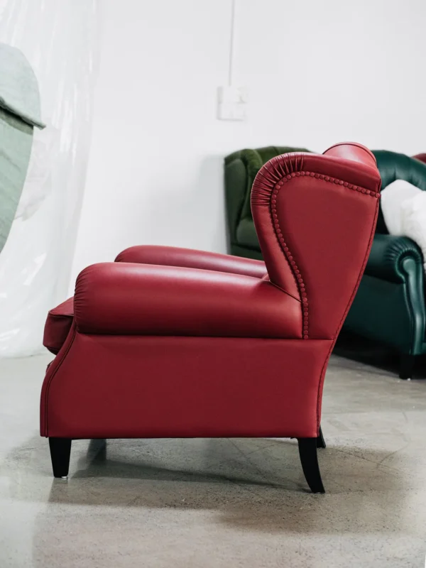 Cigar Wingback Armchair in Red Leather — in a room setting