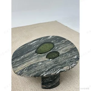 Green-Veined Marble Round Coffee Table with Inset Discs in olive — in a room setting