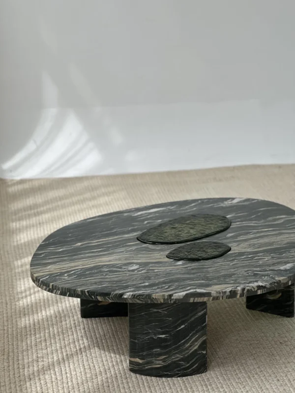 Green-Veined Marble Round Coffee Table with Inset Discs in olive — in a room setting