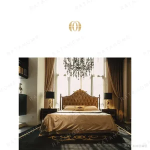 Carved Gilt Classical Bed in brushed brass — in a room setting