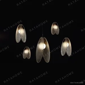 Clear Textured Leaf Pendant Light, Three Sizes in ivory — in a room setting