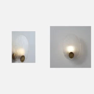 Textured Glass Leaf Wall Light with Brass Hub in silver — in a room setting