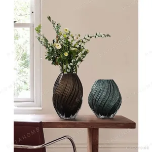 Twisted Rib Clear Glass Vases in Smoke and Green — in a room setting