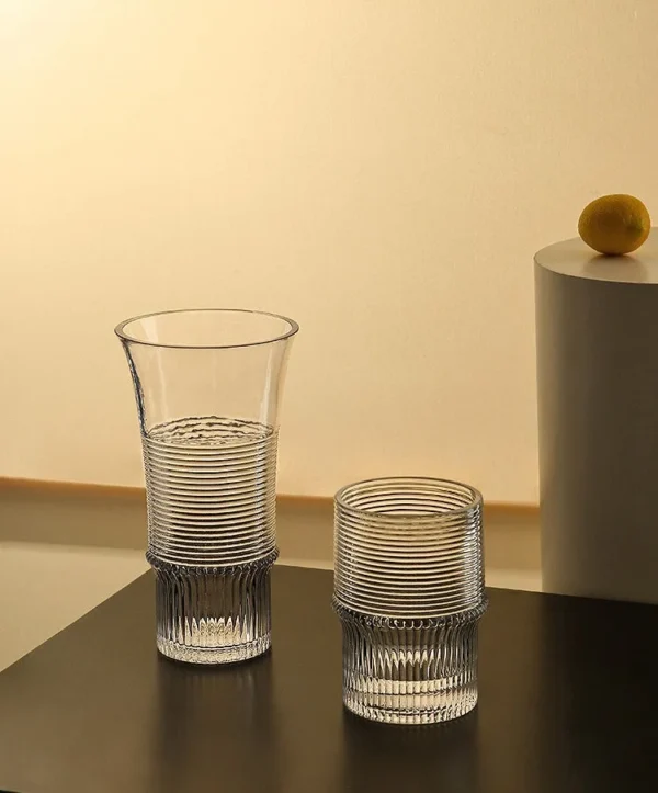 Clear Ribbed Glass Vases with Flared Rim, Small in ivory — in a room setting