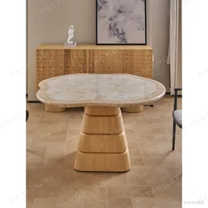 Cloud Free-Form Travertine Table on Stacked Oak Base in oatmeal — in a room setting
