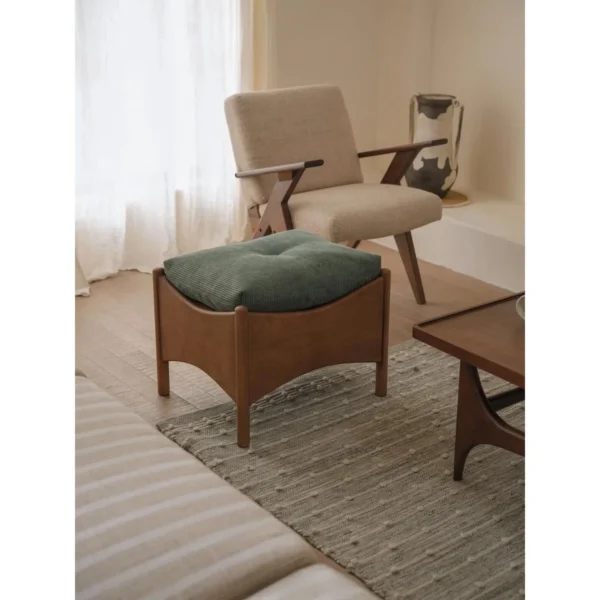 Joker Ash Wood Stool with Removable Green Corduroy Cushion in walnut — in a room setting