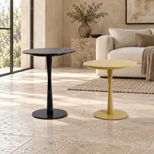 Round Pedestal Side Table Pair in black — in a room setting