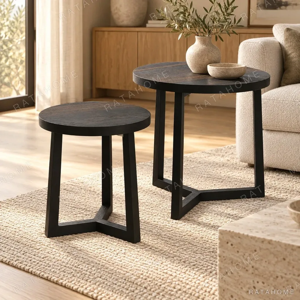 Round Black Veneer Side Table Pair in black — in a room setting