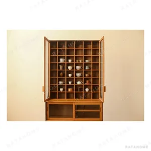Walnut Collector's Cabinet with Grid Display and Drawers in clay — in a room setting