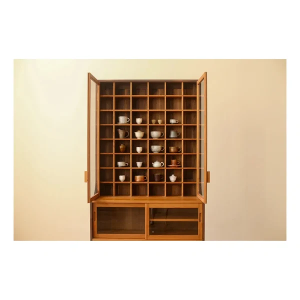 Walnut Collector's Cabinet with Grid Display and Drawers in clay — in a room setting