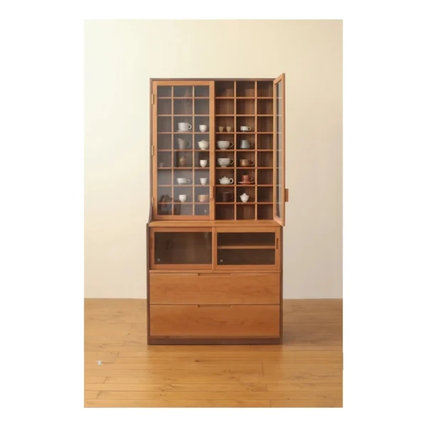 Walnut Collector's Cabinet with Grid Display and Drawers in clay — in a room setting