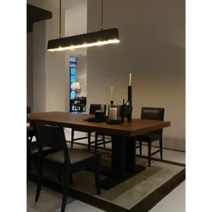 Colonie Black Brushed Oak Dining Table on Trestle Base in black — in a room setting