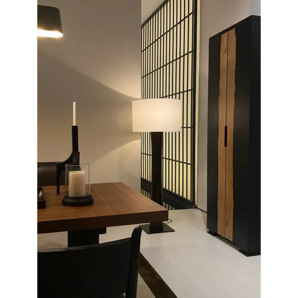 Colonie Black Brushed Oak Dining Table on Trestle Base in black — in a room setting