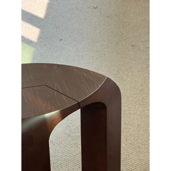 Dark Wood Arched Stool Side Table in walnut — in a room setting