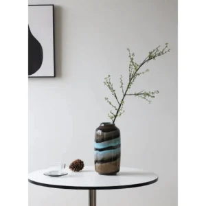 Colourful Banded Glass Vase in mustard — in a room setting