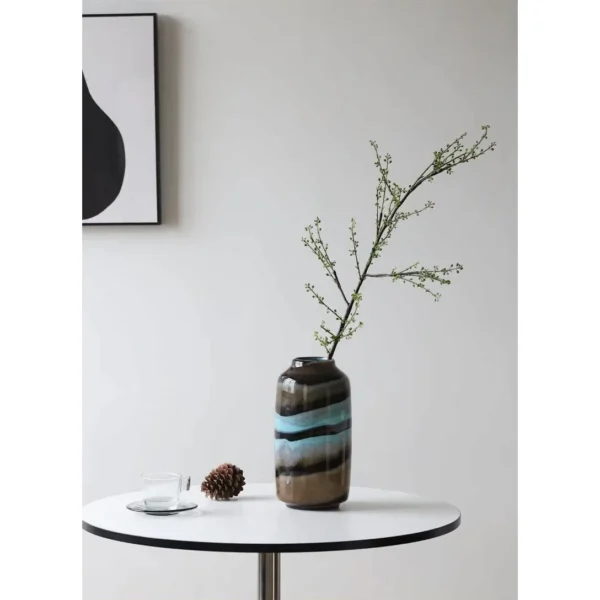 Colourful Banded Glass Vase in mustard — in a room setting
