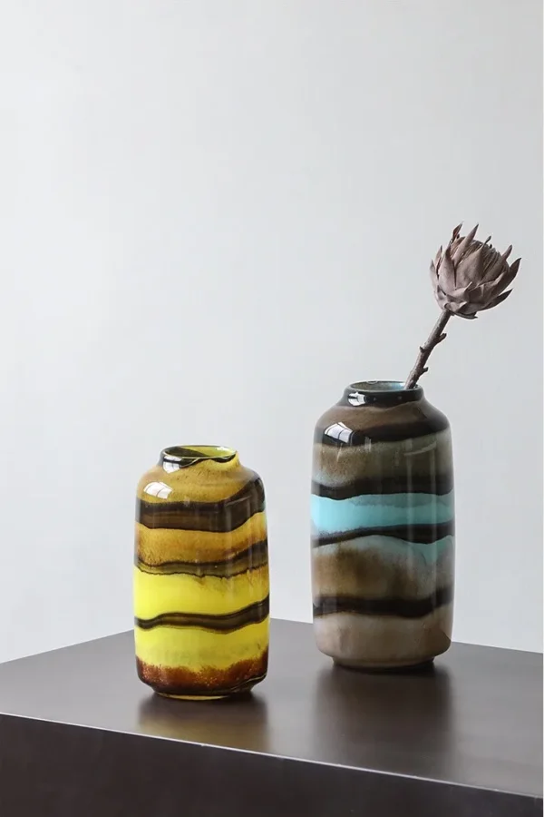 Colourful Banded Glass Vase in mustard — in a room setting