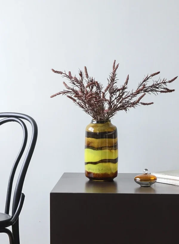 Colourful Banded Glass Vase in mustard — in a room setting