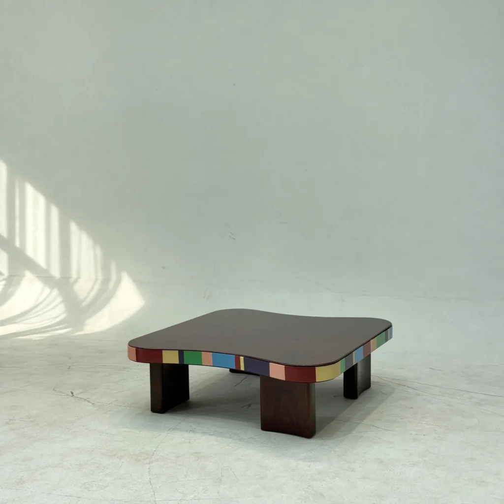 Colourful Striped Edge Mid-Century Coffee Table in black — front view
