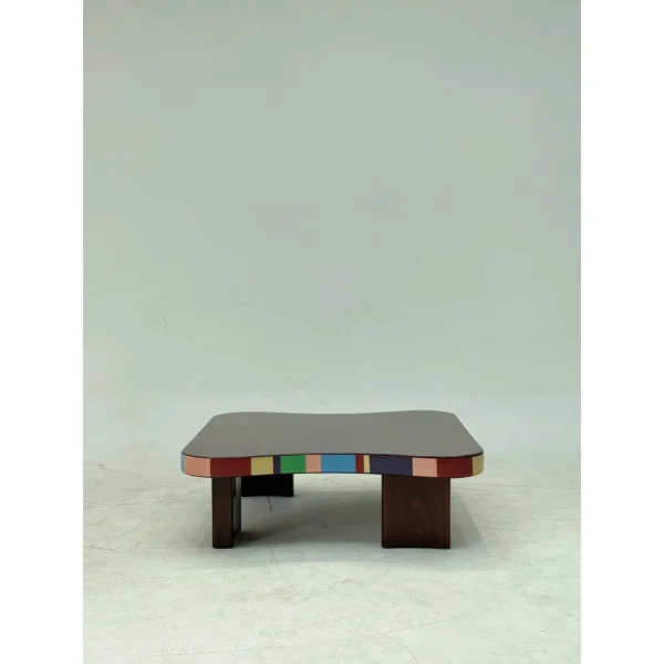 Colourful Striped Edge Mid-Century Coffee Table in black — in a room setting