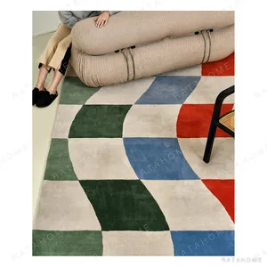 Colourful Wavy Checkerboard Rug in Green, Blue and Orange — in a room setting