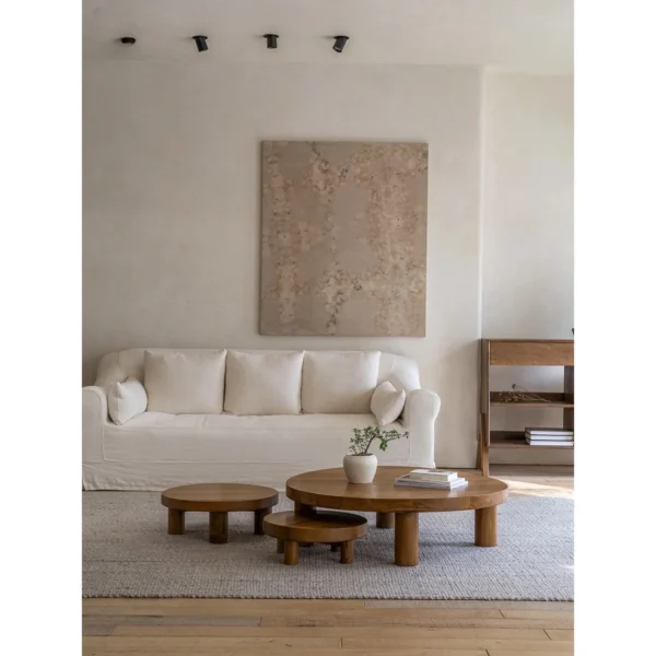 Teak Round Coffee Table Set of 3 on Cylinder Legs in natural oak — in a room setting