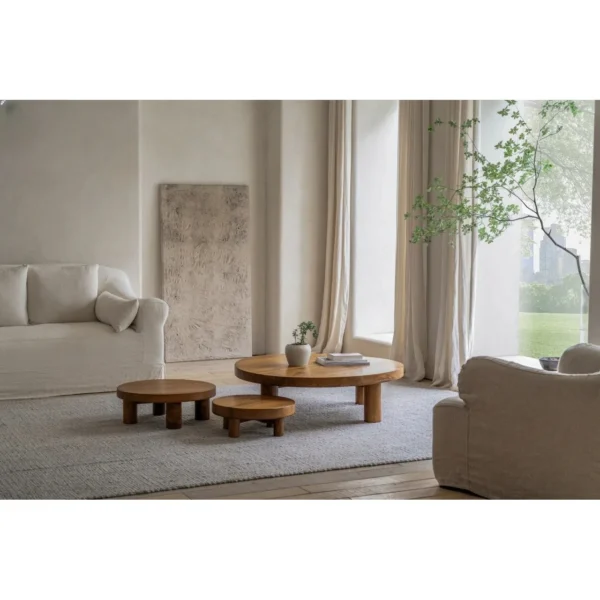 Teak Round Coffee Table Set of 3 on Cylinder Legs in natural oak — in a room setting