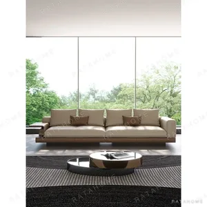 Connelly Full-Grain Leather Sofa with Flip-Top Side Panels in oatmeal — in a room setting