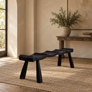 Contour Wave Bench in Charred Black Wood — in a room setting