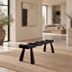 Contour Wave Bench in Charred Black Wood — in a room setting