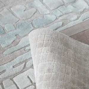 Cool Tone Salt Lake Texture Rug in Blush and Ice Blue — in a room setting