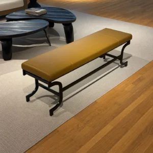 Curved Bronze Leg Bench with Caramel Leather Seat in clay — front view