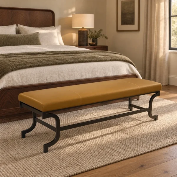Curved Bronze Leg Bench with Caramel Leather Seat in clay — in a room setting