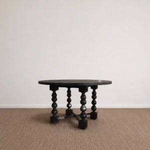 Courtyard Black Round Table on Hand-Carved Column Legs in black — front view