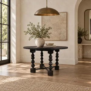 Courtyard Black Round Table on Hand-Carved Column Legs in black — in a room setting