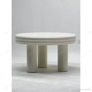 Cream Stacked-Edge Round Table on Column Legs in oatmeal — in a room setting