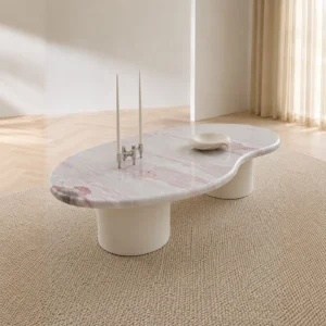 Pink Marble Organic Coffee Table on White Cylinder Legs in rose stone — front view