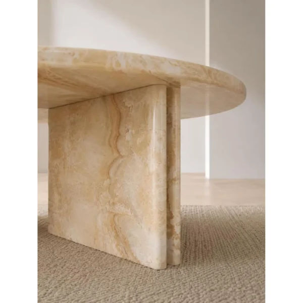 Cream Onyx Round Coffee Table on Cross Stone Base in oatmeal — in a room setting