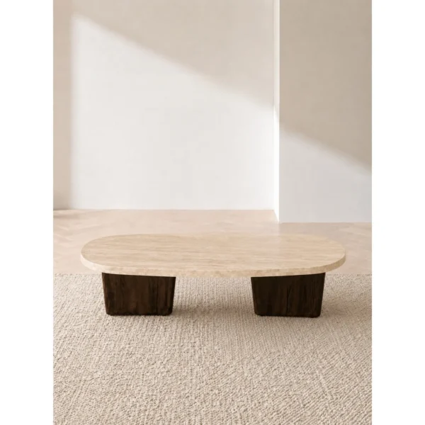 Organic Travertine Coffee Table on Dark Wood Legs in oatmeal — in a room setting