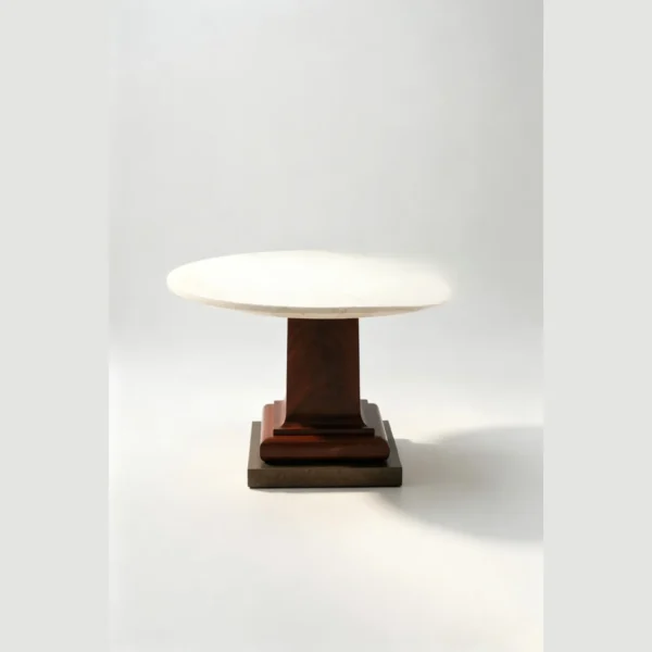 Cream Travertine Round Table in oatmeal — in a room setting