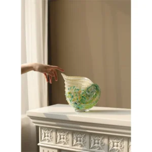 Conch Shell Glass Vase in Green and Yellow, Medium — in a room setting
