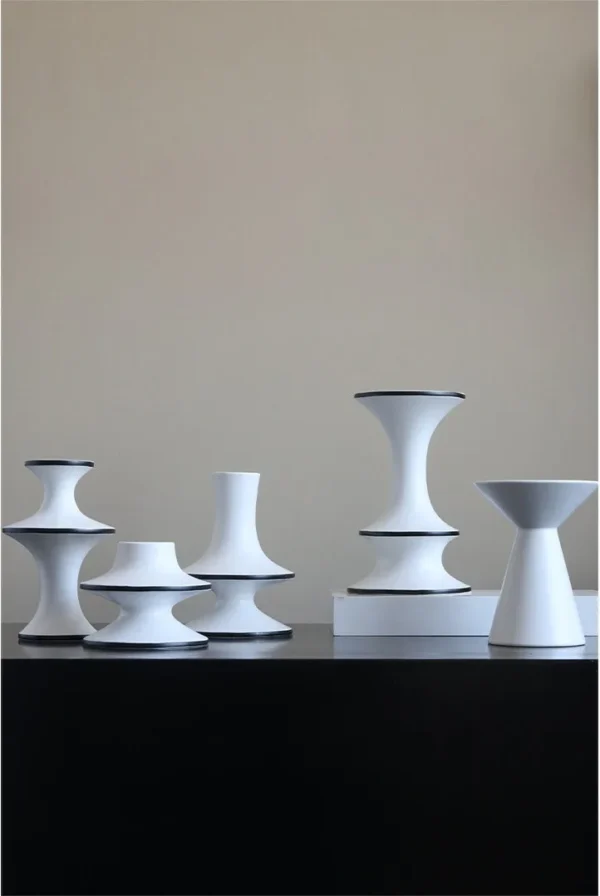 Dancing Form White Ceramic Bud Vases, Three Sizes in ivory — in a room setting