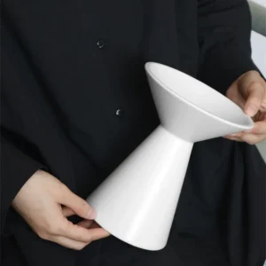 Dancing Form White Ceramic Bud Vases, Three Sizes in ivory — in a room setting