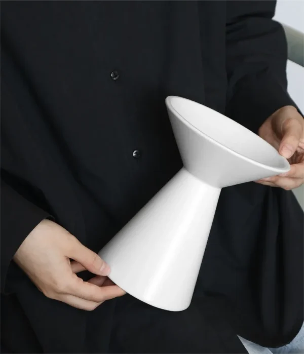 Dancing Form White Ceramic Bud Vases, Three Sizes in ivory — in a room setting