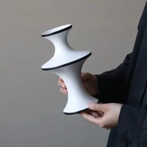 Dancing Form White Ceramic Bud Vases, Three Sizes in ivory — in a room setting