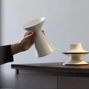 Dancing Form White Ceramic Bud Vases, Three Sizes in ivory — in a room setting