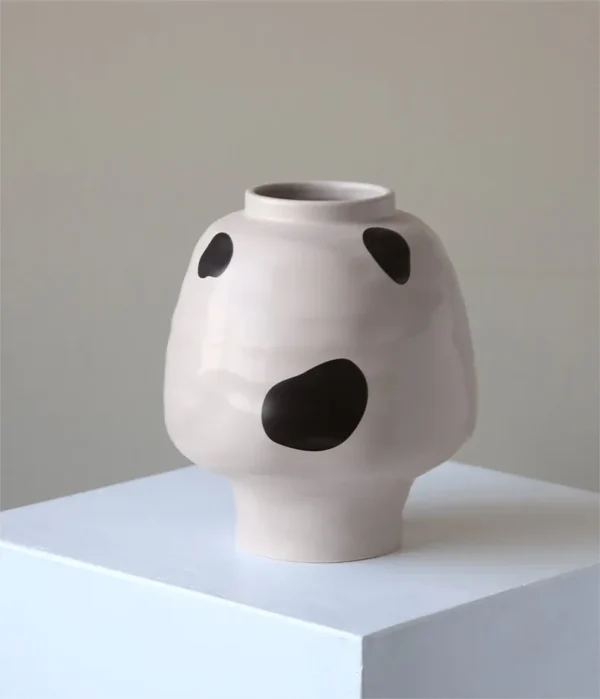 Cream Round-Belly Ceramic Jar in oatmeal — in a room setting