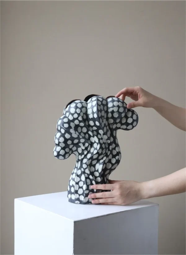 Jingdezhen Black and White Dotted Sculptural Art Vase, Large in black — in a room setting