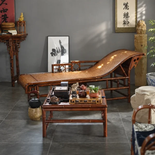 Curved Bamboo and Woven Cane Chaise Lounge in black — in a room setting
