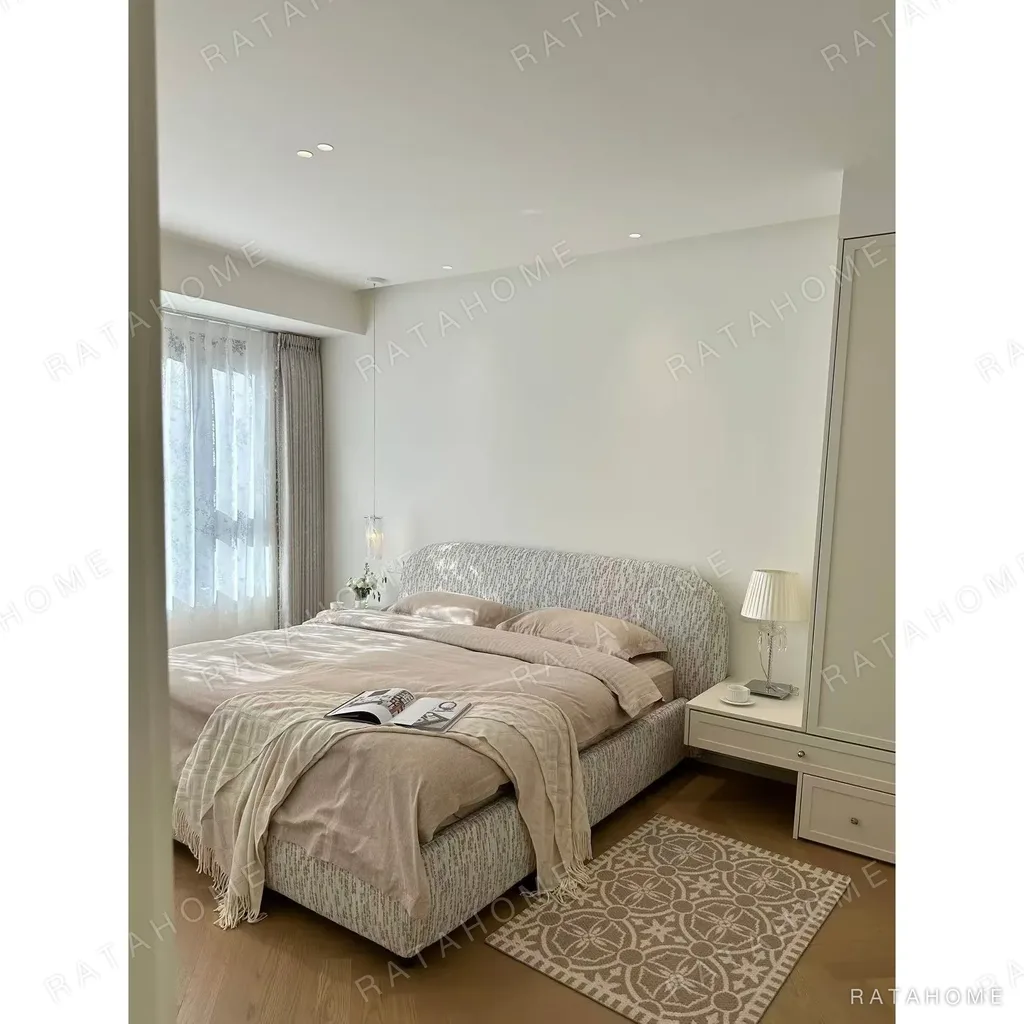 Curved Cotton-Linen Bed with Inset Mattress Frame in sand — in a room setting